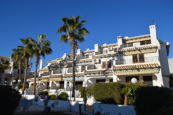 Big townhouse with small garden only 70 m from Cala Capitán beach. 
